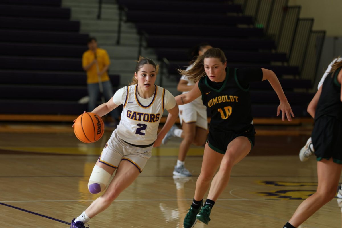 Alexsandra Alvarado (2) attempts to get the ball past Dylan Lovett (10) on Saturday, Feb. 15, 2025. (Haley Abarca / Golden Gate Xpress)